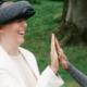 Photo of a blind girl using SuperBrain and doing a high five